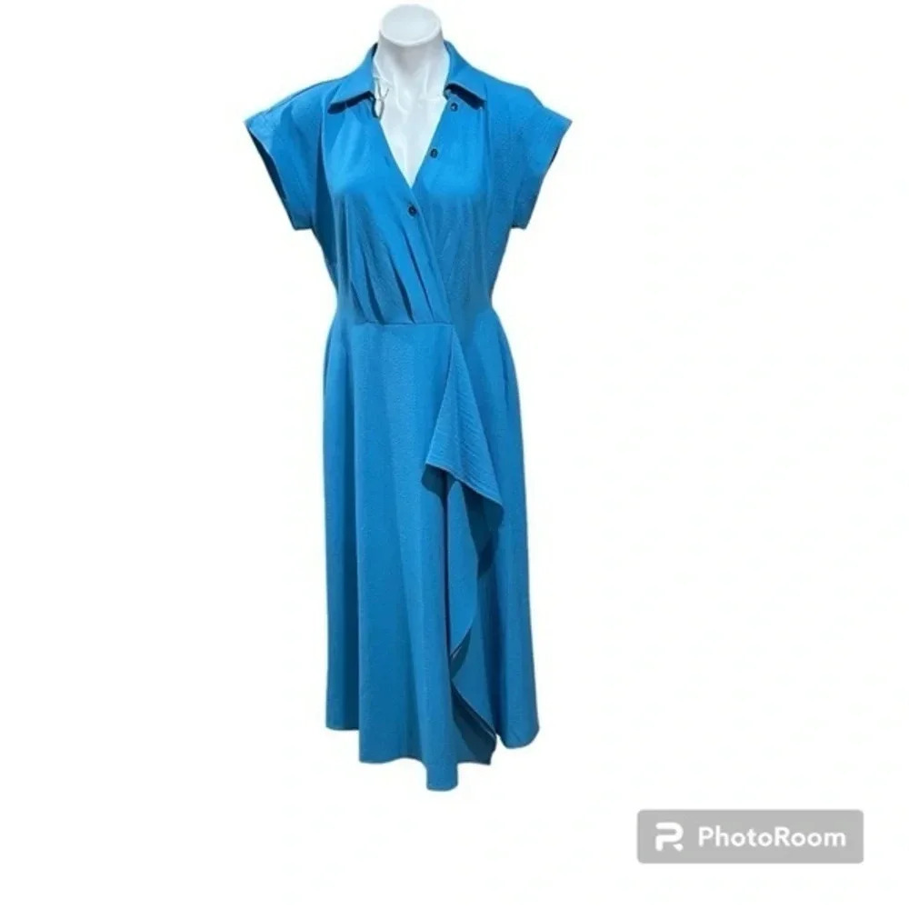 Calvin Klein midi dress
Flare
Raffle trim neck
Elastic waist